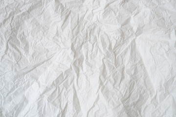 Wrinkled or crumpled white stencil or tissue paper used for crumpled paper background texture.