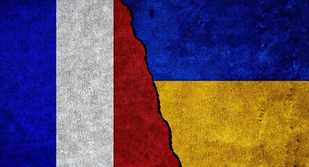Ukraine and France flag together on a textured wall. Relations between France and Ukraine
