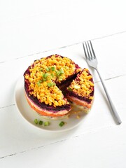 Layered vegetable salad with herring and boiled vegetables