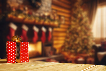 Winter mockup of wooden desk and christmas gifts. Santa Claus home interior with fireplace and ...