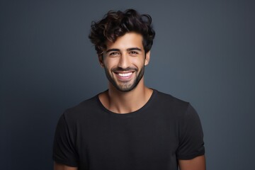 Young man with beautiful smile on grey background. Teeth whitening