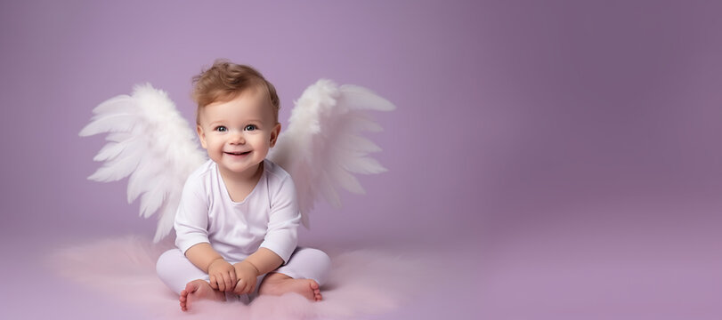 Cute baby white angel wings enjoys a moment of happiness on a paste purple colored background,banner,copy space.