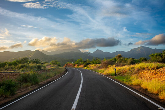 Road to the Macanao mountains early in the morning. Exploration towards a cave. Journey to adventure