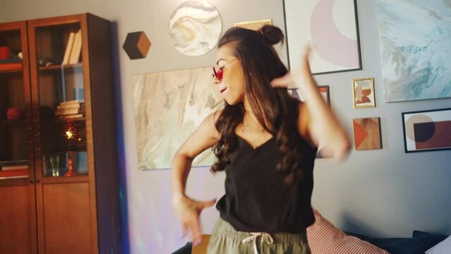 Teenagers womans shooting together dancing at home when making video for social media, stories hip hop popular trandy dance, students at home make content