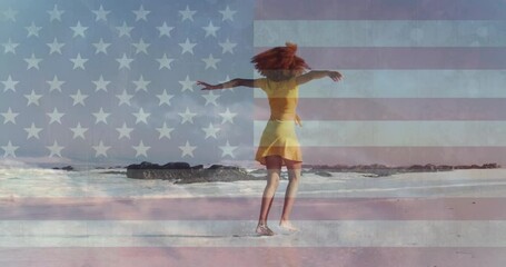 Animation of american flag and clouds over african american woman dancing on sunny beach
