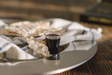 Communion. Religious tradition of breaking bread. Bread and wine as a sign of memory of Christ's sacrifice.