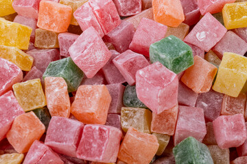 Closeup of multicolored cubes Turkish delight (Lokum). Selective Focus. Flat lay.