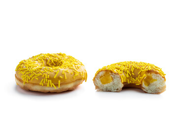 Yellow glazed doughnuts in gray tray isolated on white