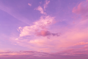 Epic dramatic pink purple violet blue beautiful sky. Beautiful soft gentle sunrise, sunset with cirrus clouds in sunlight background texture