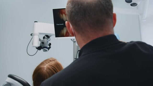 Experienced dentist showing x-ray image of teeth explaining treatment for young woman. Dental care. Orthodontic checkup. Dentistry. Lockdown. Healthcare.