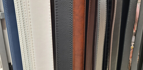 Leather multi-colored belts on display in store