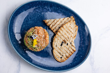 Fresh Tatar on a plate. Close-up