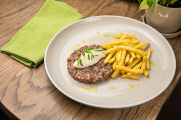 Fresh Tatar on a plate. Close-up