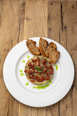 Fresh Tatar on a plate. Close-up