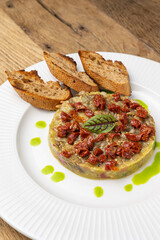 Fresh Tatar on a plate. Close-up