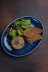 Fresh Tatar on a plate. Close-up