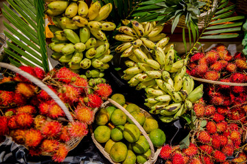 Fototapeta premium Various different types of organic fruits on display. Assortment fruits and berries in the market or buffet. Catering for birthday, wedding, Sunday brunch or other event