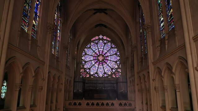 Circular stained glass window, rich in symbolism.