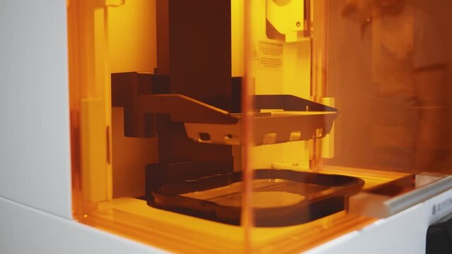 Progressive 3D printing technology machine is capable of producing dental crowns, partial dentures, and bridges. Making dental prosthetics. Healthcare facilities. Dentistry.