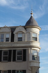 The ornament at the top of the building is very unusual.