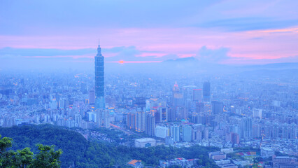 Panoramic aerial view of Downtown Taipei City at dusk, with Taipei 101 Tower in Xinyi Commercial...