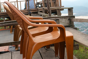Wooden chairs on the terrace at the top of the mountain