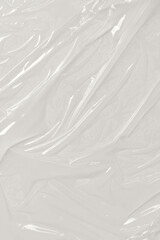 Plastic transparent on white background. White plastic film wrap texture background. White Plastic...