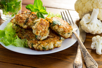 cooked vegetarian fried cauliflower cutlets in a plate