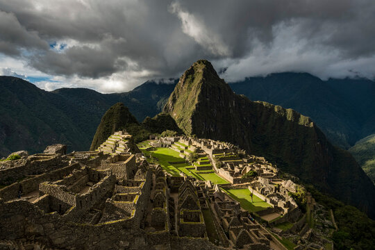 Inca ruins of Machu Picchu with reconstructed stone buildings; Peru