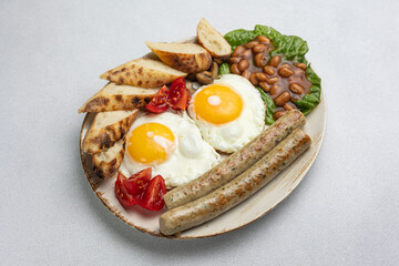 English breakfast - eggs, sausages, beans and tomatoes