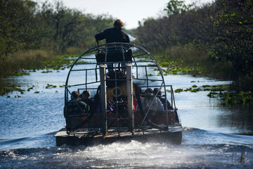 Tourists on an airboat ride in Everglades National Park, Florida; Florida, United States of America