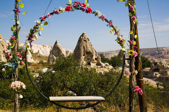View through circular swing seat of Cave Houses near Goreme, Pigeon Valley, Cappadocia, Turkey