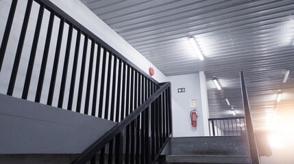 Interior of the stairs leading to the top floor in an industrial office building.