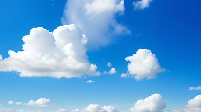 image of a clear blue sky adorned with fluffy white clouds