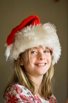 Portrait of a 10-year-old girl in her Santa hat; Lincoln, Nebraska, United States of America