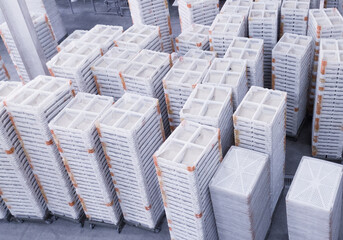 Stack of broiler doc boxes on the hatchery industry. Side top view of the chicken new born container boxs.