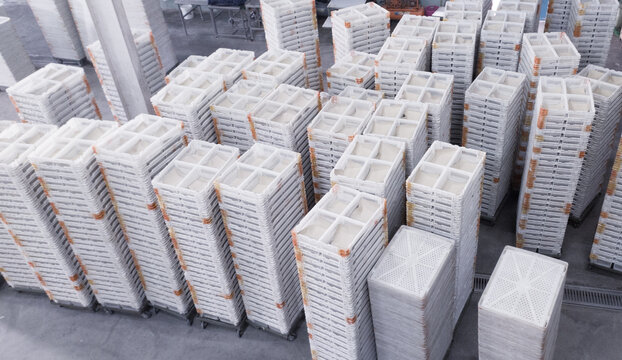 Stack of broiler doc boxes on the hatchery industry. Side top view of the chicken new born container boxs.