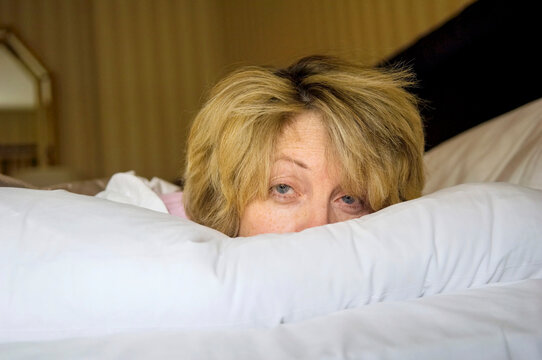 Woman tried to sleep in a bed; New York City, New York, United States of America