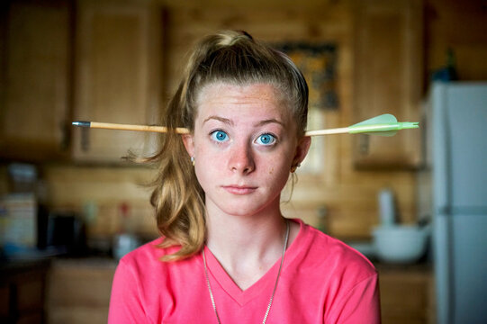 Teenage girl with an arrow through her head; Minnesota, United States of America