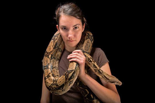 Young woman holds a Red-tailed boa constrictor (Boa constrictor constrictor); Lincoln, Nebraska, United States of America