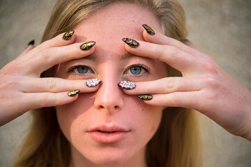 Decorative nail art on a teenage girl; Lincoln, Nebraska, United States of America