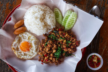 Minced Pork Stir-Fried with Basil, Fried Egg, and Jasmine Rice. A Highly Popular and Delicious Dish Set. The Basil Dish is Widely Renowned in Thailand.