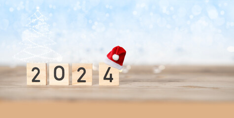 numbers 2024 on vintage wooden table, Santa Claus Hat, start new calendar year, Time Management and...