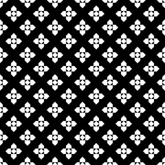 Repeated white figures on black background. Ethnic wallpaper. Seamless surface pattern design with floral ornament. Rhombuses and pentagons motif. Digital paper for textile print, web designing.