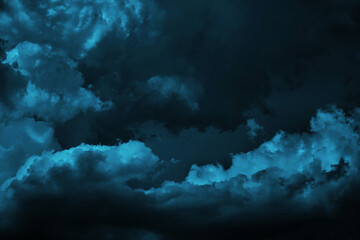 Black dark greenish blue dramatic night sky. Gloomy ominous storm rain clouds background. Cloudy...