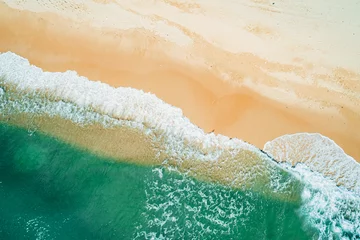 Stoff pro Meter Aerial view of sandy beach and turquoise ocean. Top view of ocean waves reaching shore on sunny day. © Евгений Бахчев