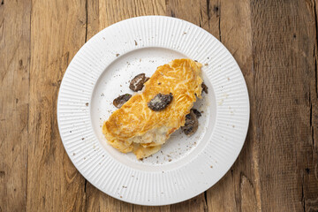 Delicious breakfast - Scrambled eggs with chicken, mushrooms and cheese