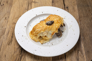 Delicious breakfast - Scrambled eggs with chicken, mushrooms and cheese