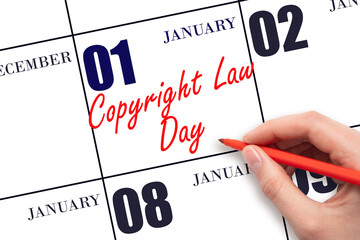 January 1. Hand writing text Copyright Law Day on calendar date. Save the date.