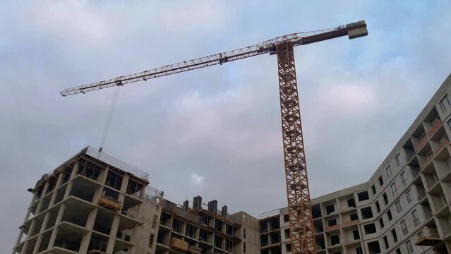 Timelapse of building a house. Crane builds a monolithic frame house at morning.